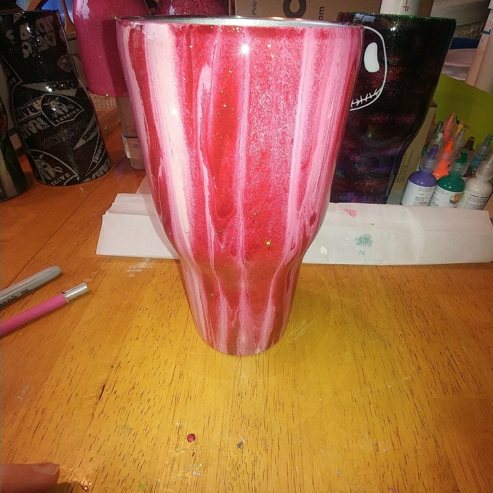 Red and pink Rtic tumbler